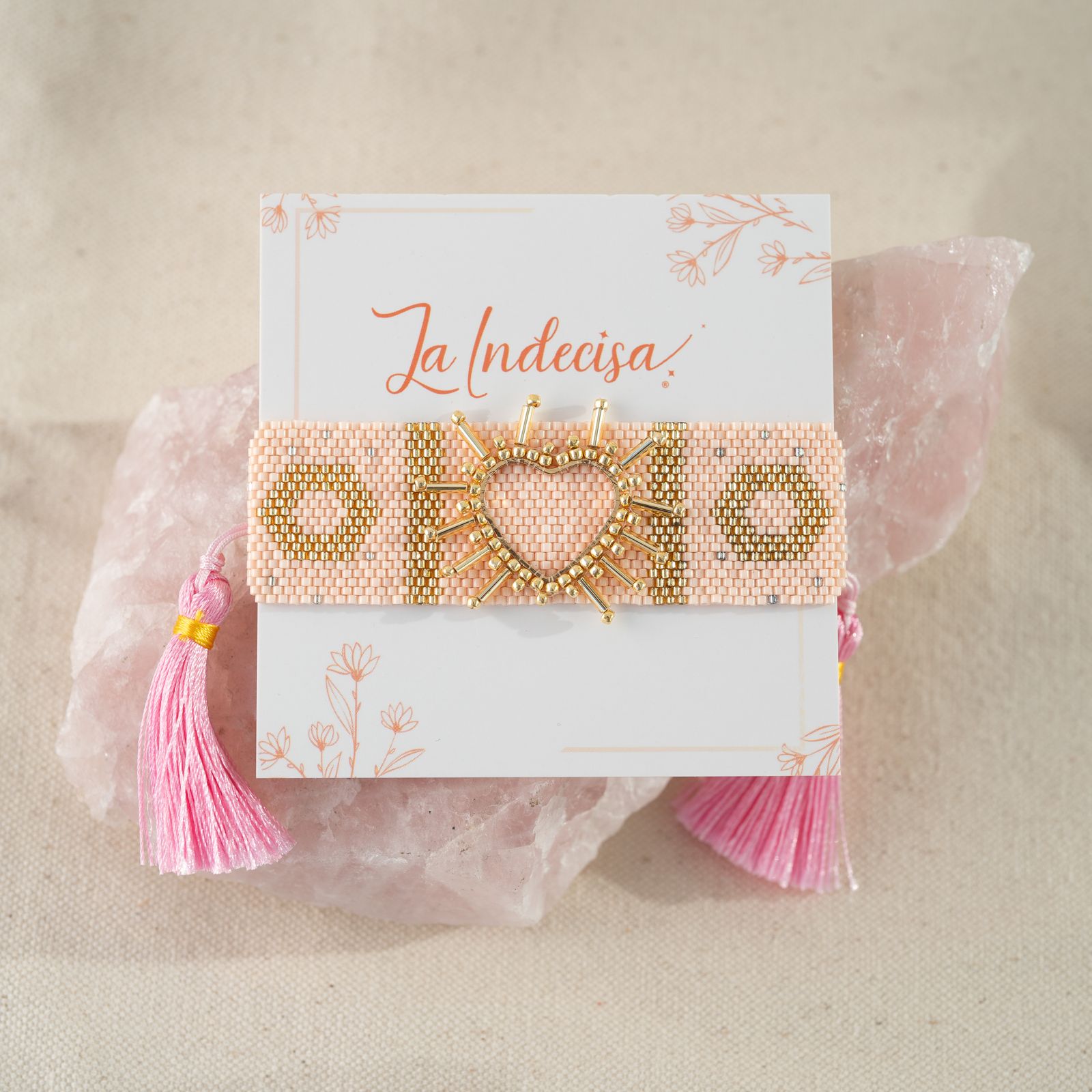 Pulsera rosada  y dorada, tejida a mano 